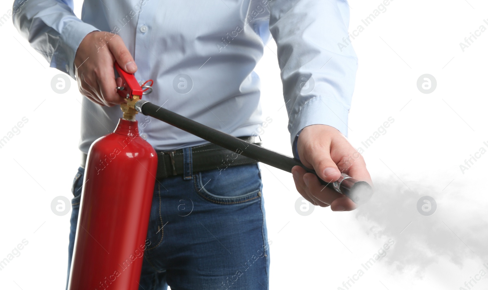 Man Using Fire Extinguisher On White Background Closeup Stock Photo