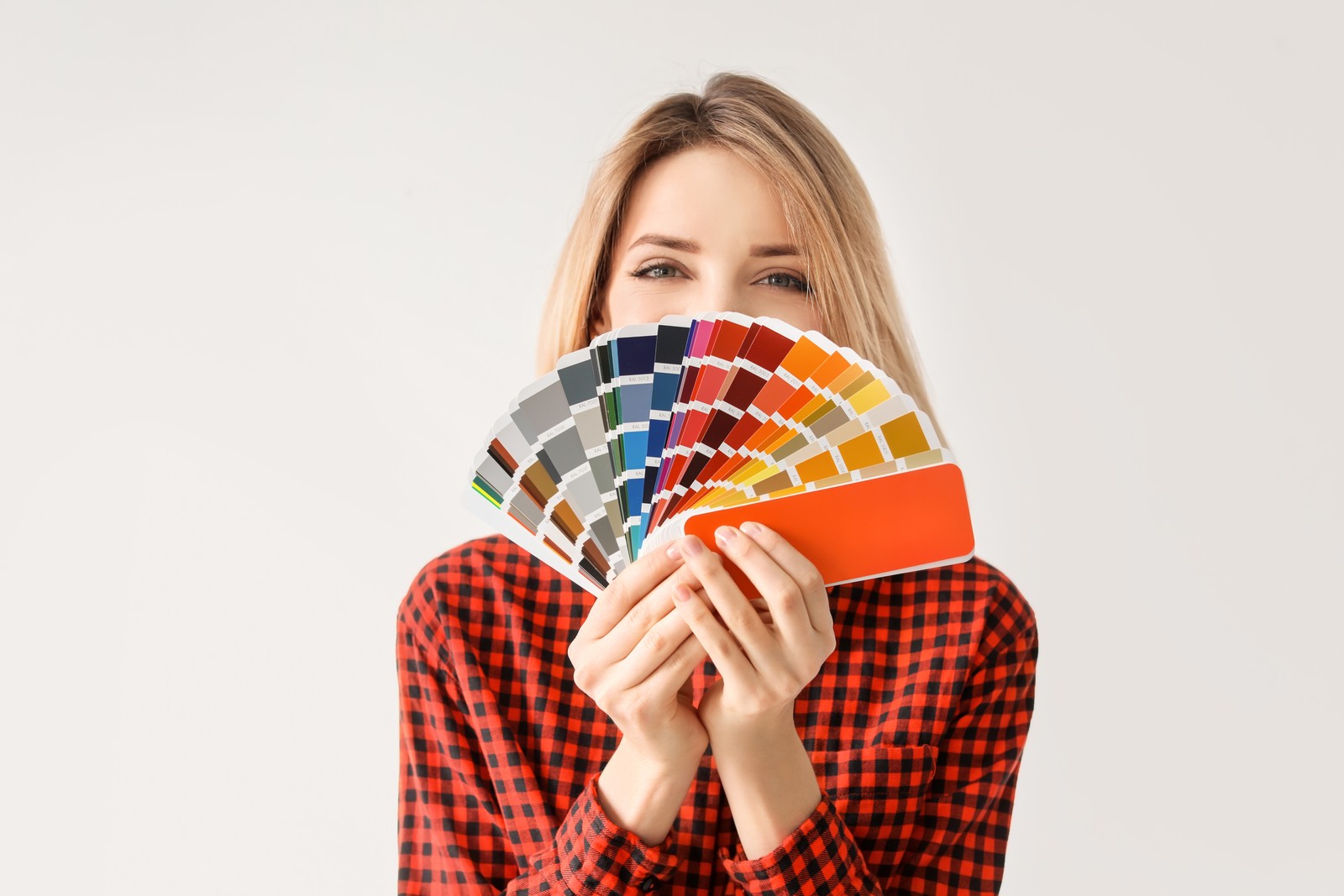 Photo of young woman with color palette on white background