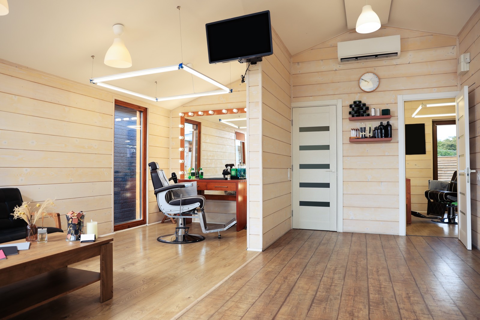 Photo of stylish barbershop interior with professional hairdresser's workplace
