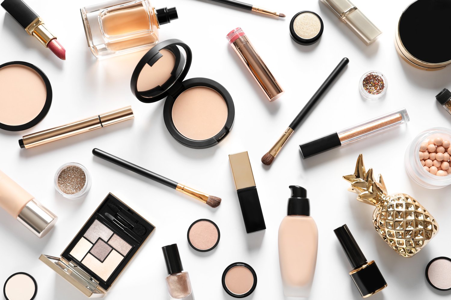 Photo of different luxury makeup products on white background, top view