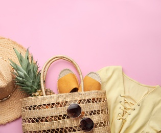 Photo of Flat lay composition with woman's straw bag on pink background