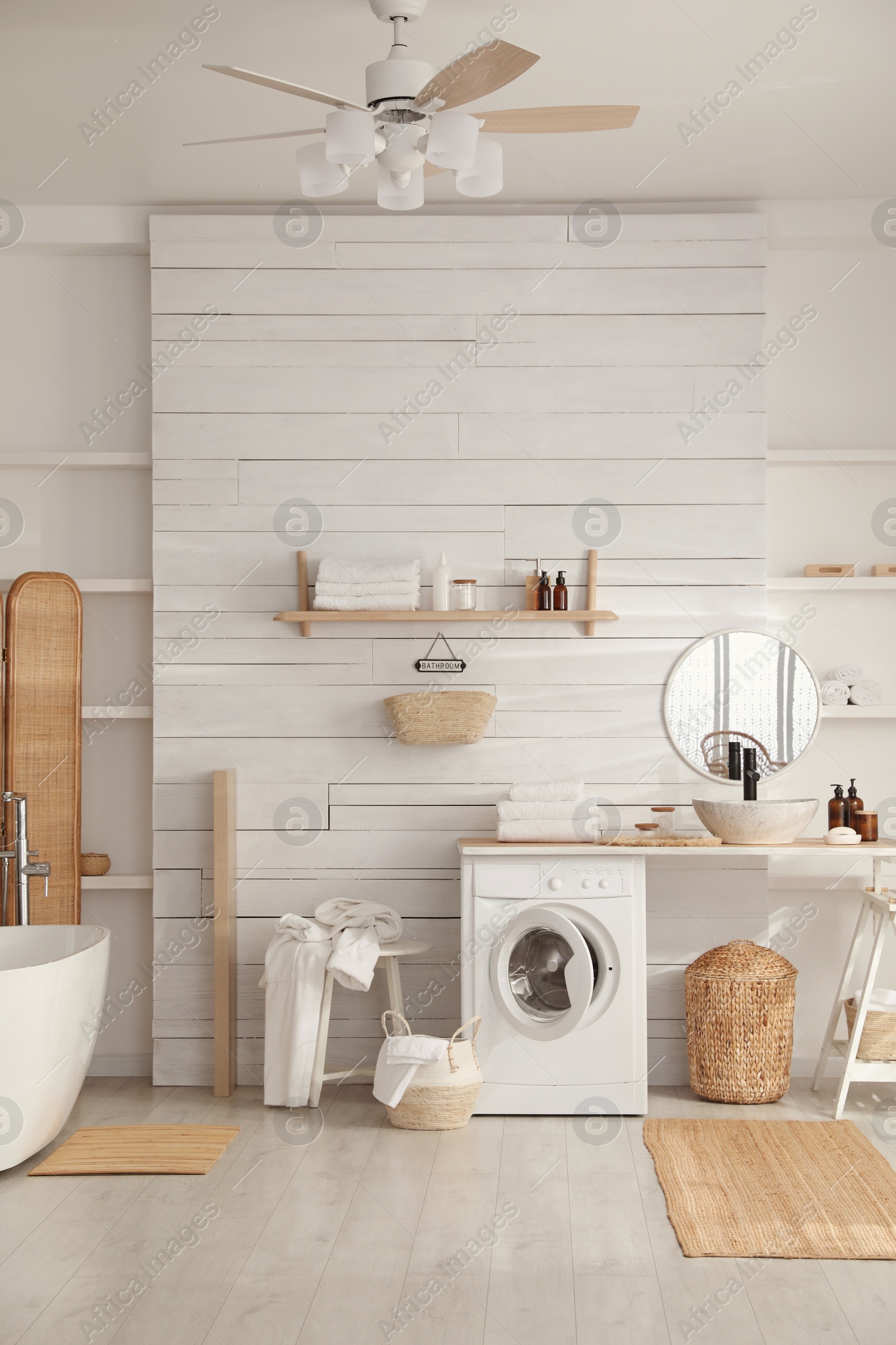 Stylish bathroom interior with modern washing machine Photo of Stylish bathroom interior with modern washing machine