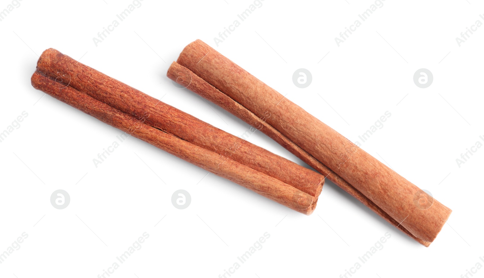 Aromatic cinnamon sticks isolated on white, top view Photo of Aromatic cinnamon sticks isolated on white, top view