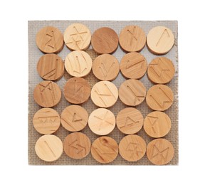 Photo of Board with many wooden runes isolated on white, top view