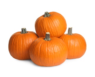 Photo of Beautiful ripe orange pumpkins on white background