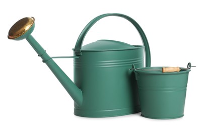 Photo of Watering can and bucket on white background