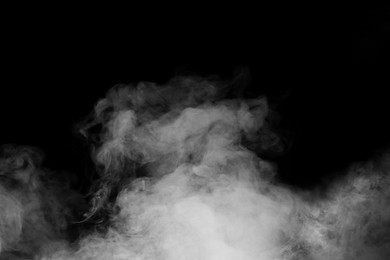 Image of Cloud of white smoke on black background