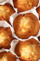 Photo of Tasty muffins as background, top view. Fresh pastry