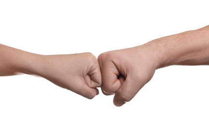 Photo of People making fist bump on white background, closeup
