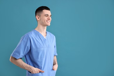 Photo of Portrait of smiling medical assistant on light blue background. Space for text