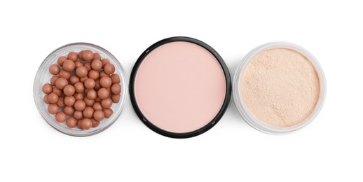 Photo of Different face powders isolated on white, top view