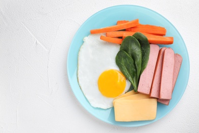 Photo of Plate with healthy breakfast on white table, top view