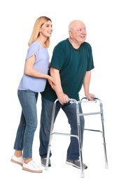 Photo of Caretaker helping elderly man with walking frame on white background