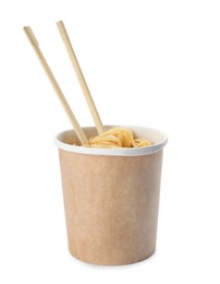 Photo of Paper cup of instant noodles and chopsticks isolated on white. Mockup for design