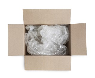 Photo of Transparent bubble wrap in cardboard box isolated on white
