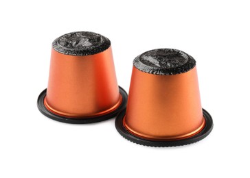 Photo of Two plastic coffee capsules isolated on white