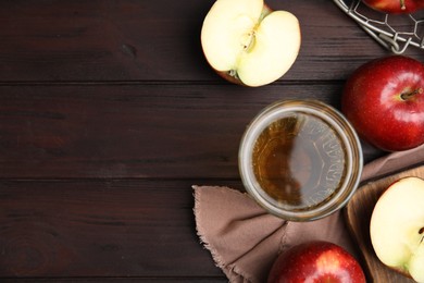 Photo of Flat lay composition with delicious apple cider on wooden table. Space for text