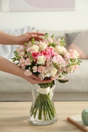Photo of Woman with beautiful bouquet of fresh flowers at home, closeup