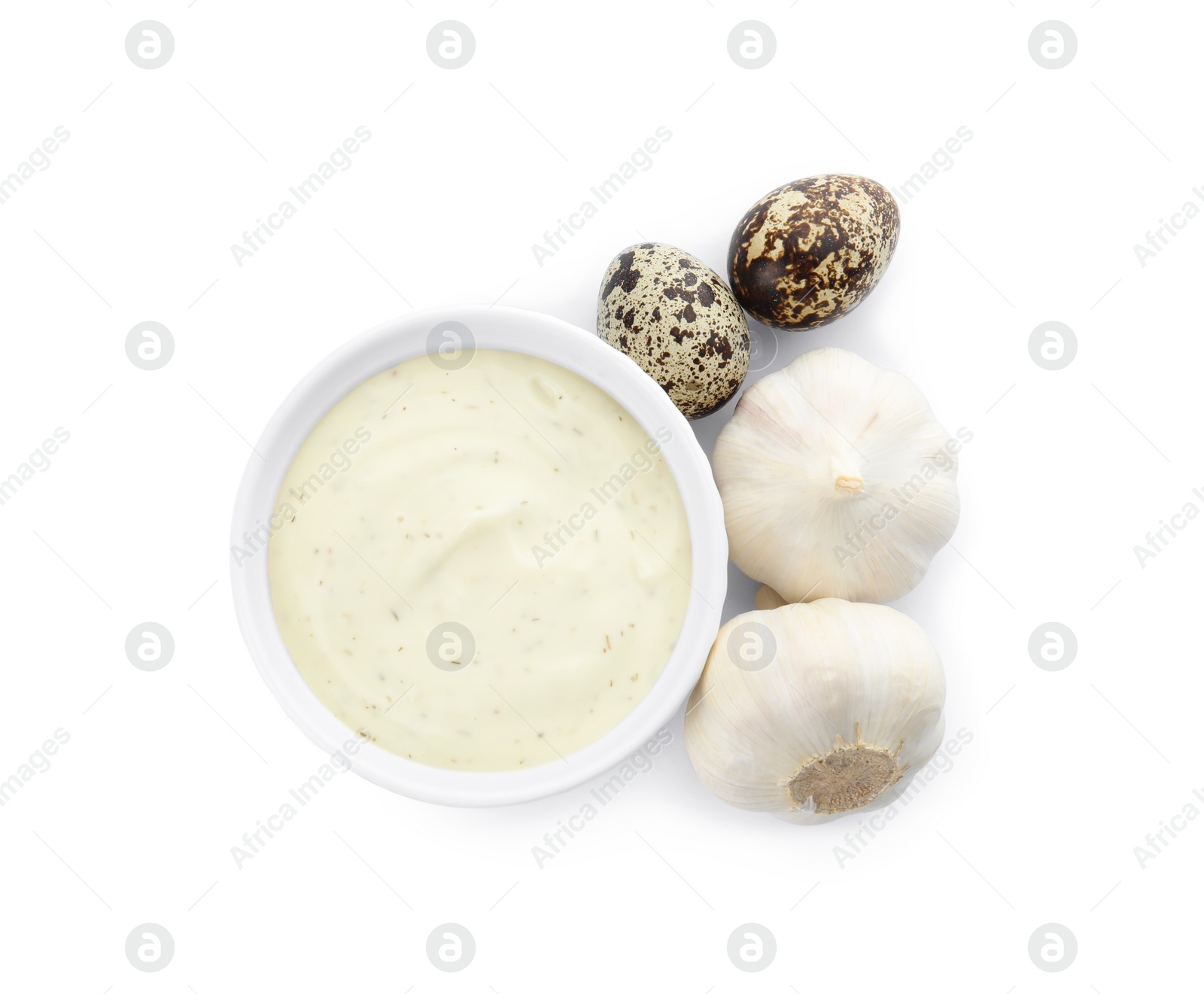 Photo of Fresh garlic bulbs, bowl of sauce and quail eggs on white background, top view