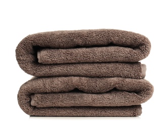 Photo of Folded soft terry towels on white background