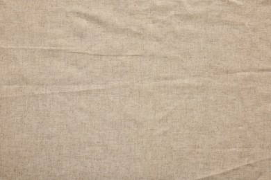 Texture of natural burlap fabric as background, top view