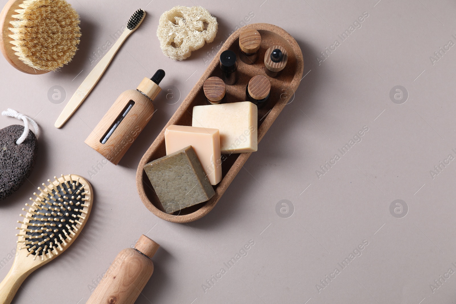 Photo of Bath accessories. Flat lay composition with personal care products on light grey background, space for text