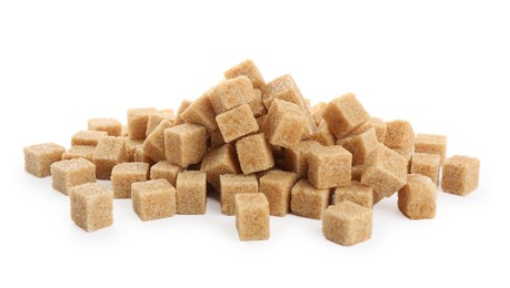Photo of Pile of brown sugar cubes on white background