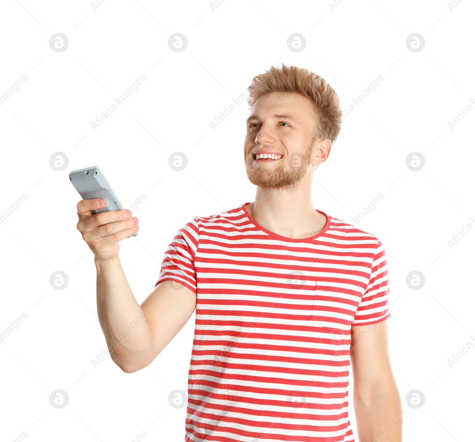 Photo of Young man with air conditioner remote on white background