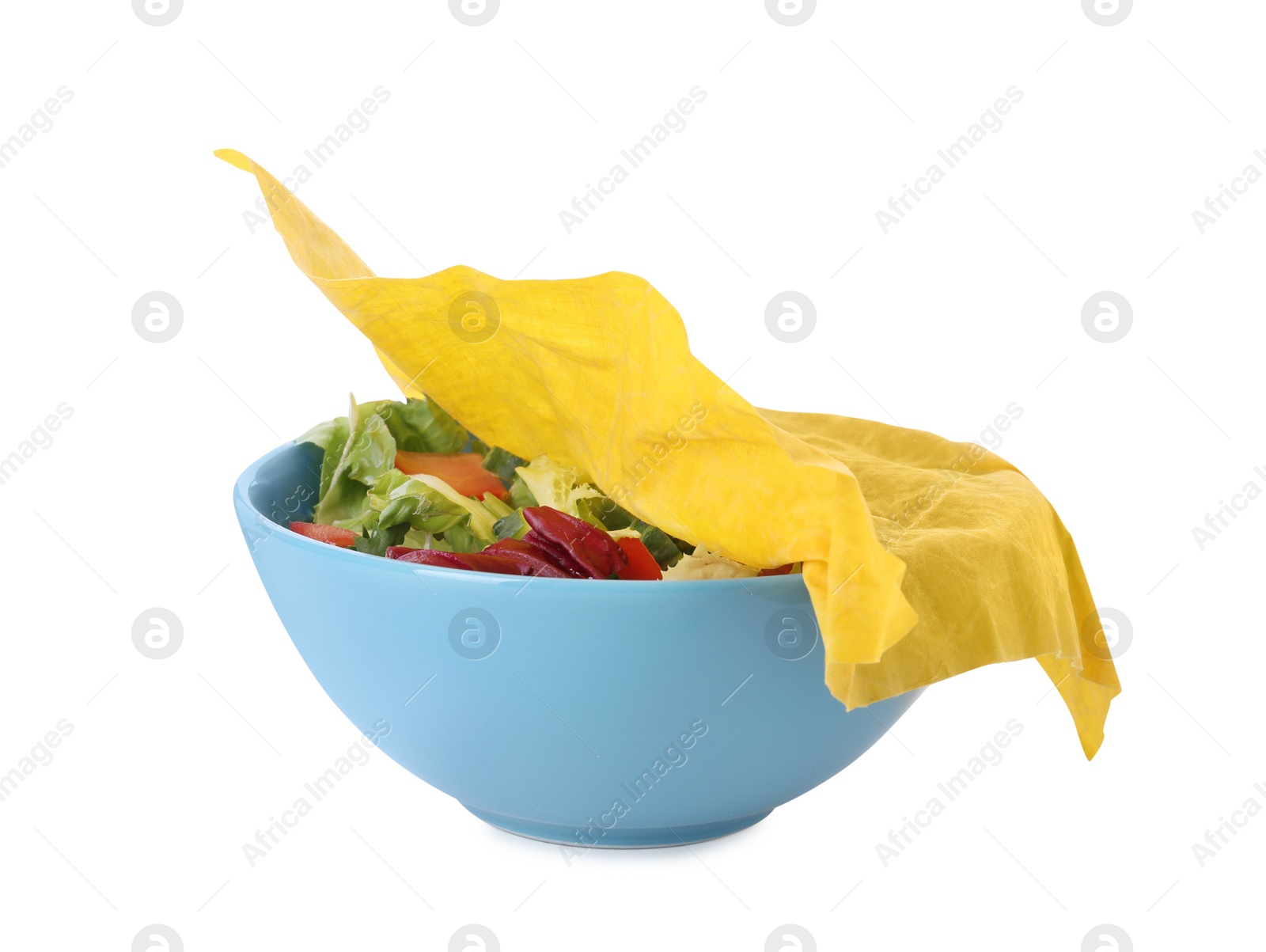 Photo of Bowl of tasty salad covered with beeswax food wrap isolated on white