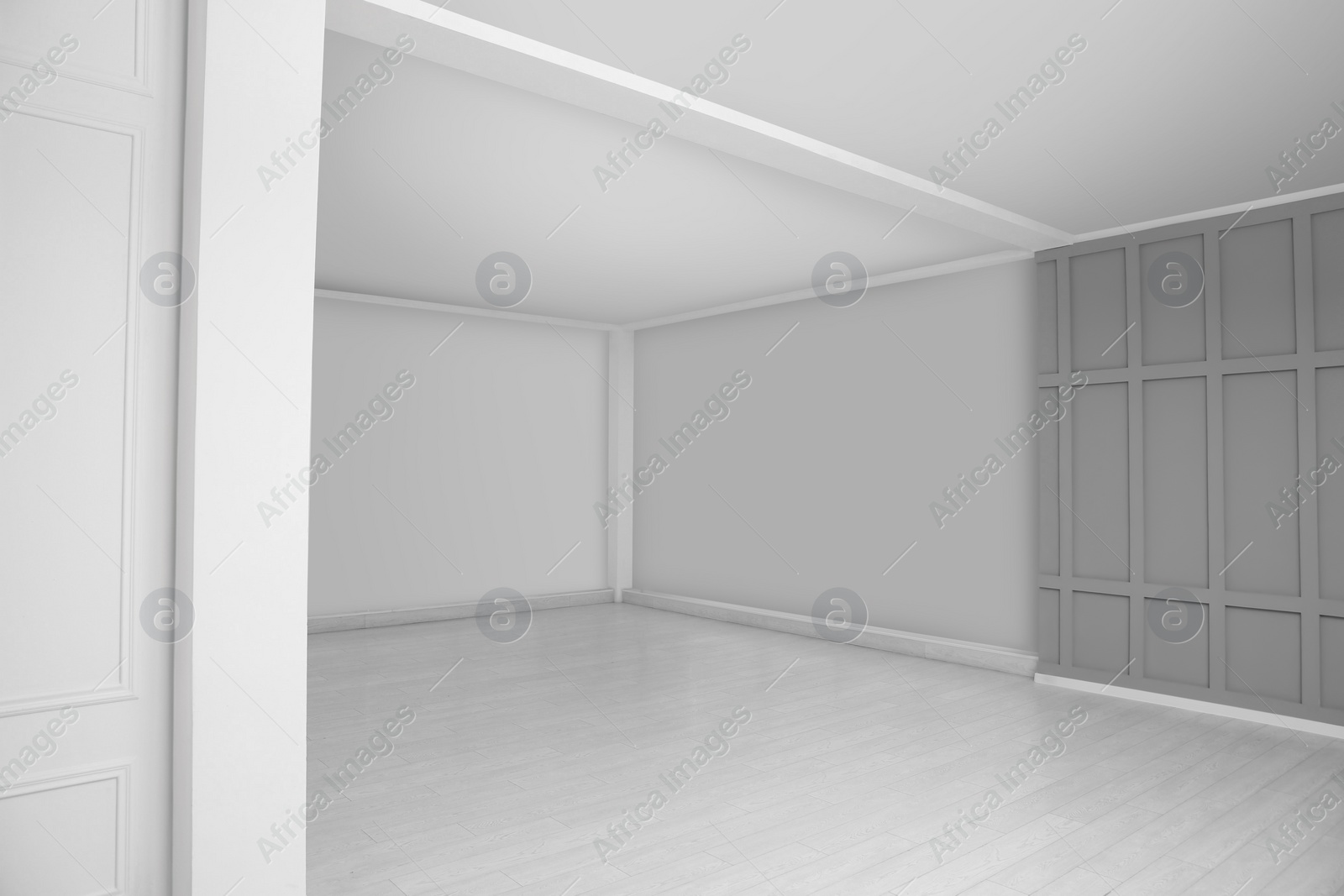 Photo of Empty room with grey wall and laminated floor