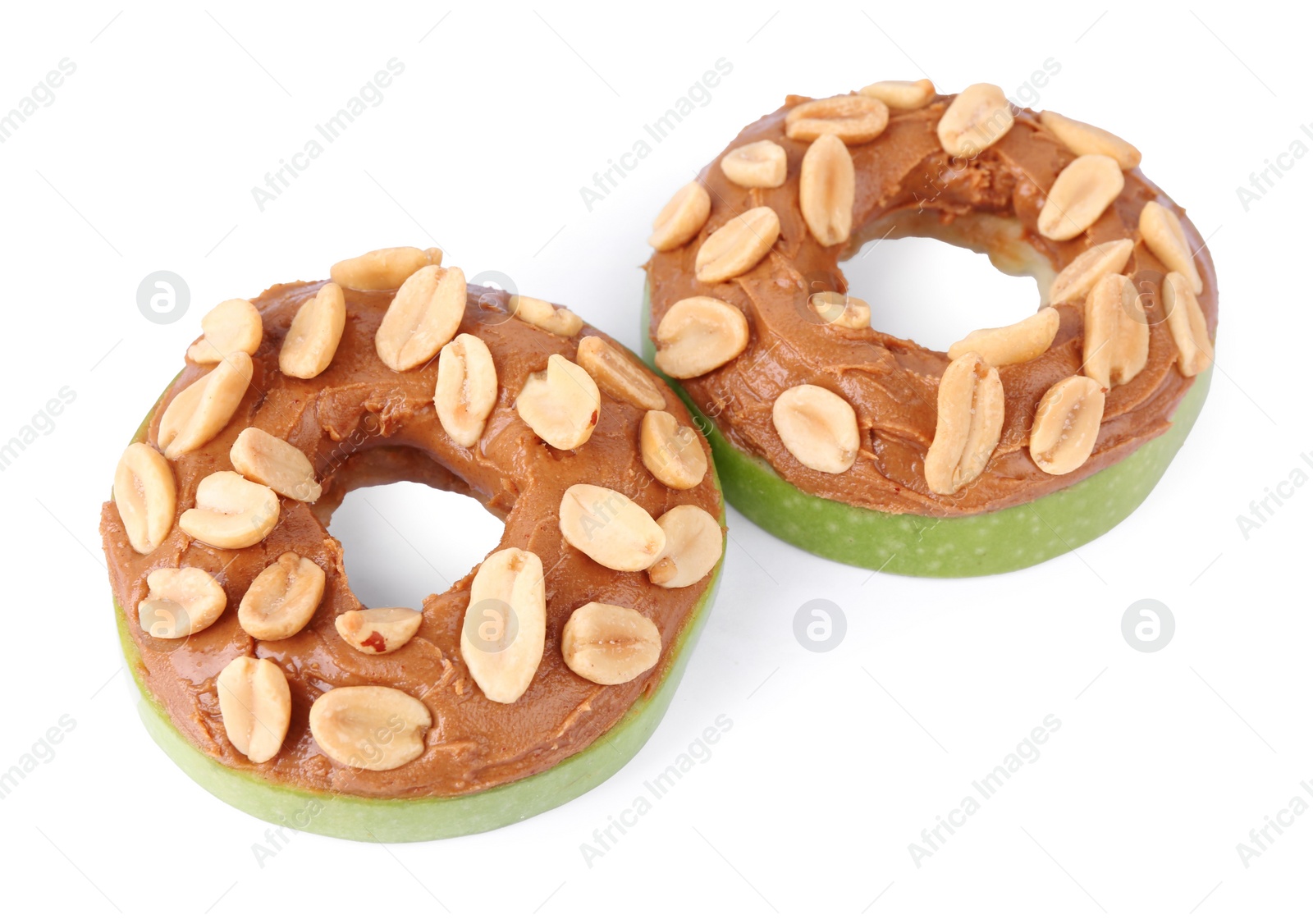 Photo of Slices of fresh apple with peanut butter and nuts isolated on white