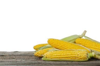 Photo of Tasty fresh corn cobs on wooden table against white background