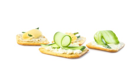 Photo of Delicious crackers with humus and cheese on white background