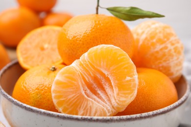 Photo of Bowl of fresh juicy tangerines, closeup view