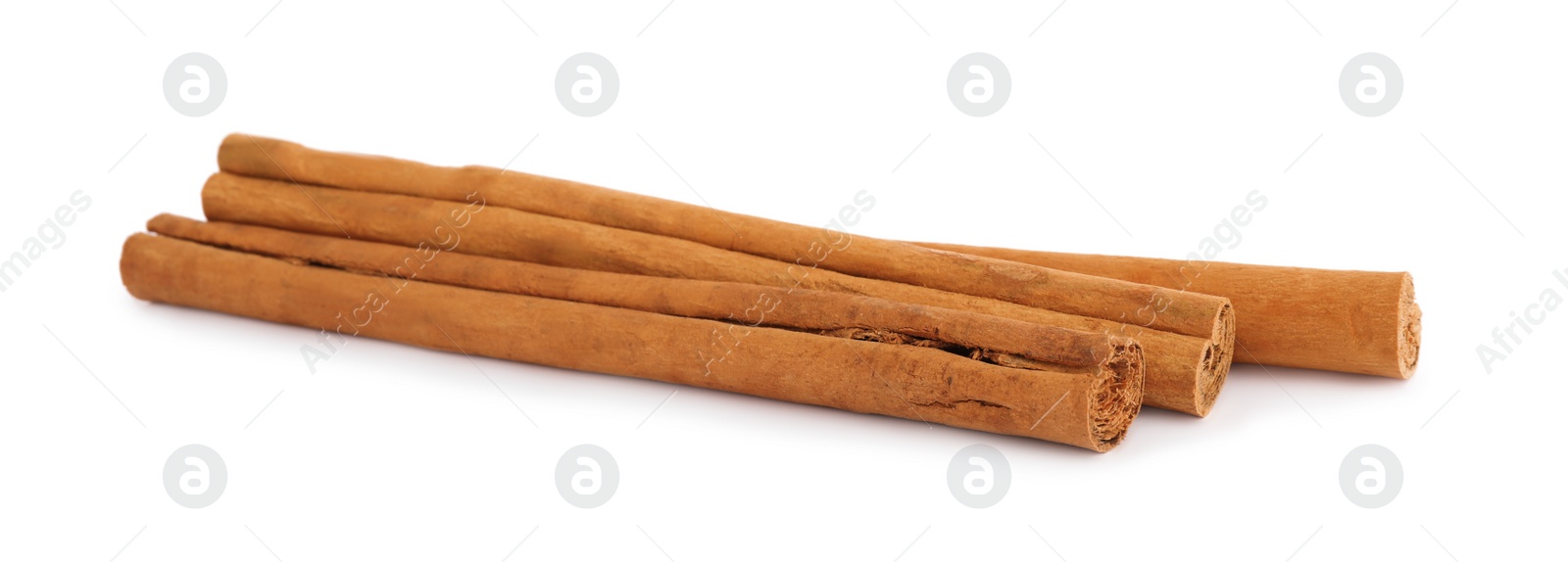 Photo of Aromatic dry cinnamon sticks on white background