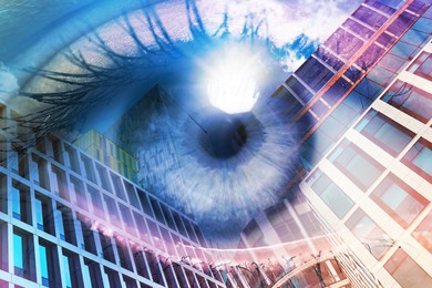 Double exposure of modern buildings and woman with beautiful eye, closeup
