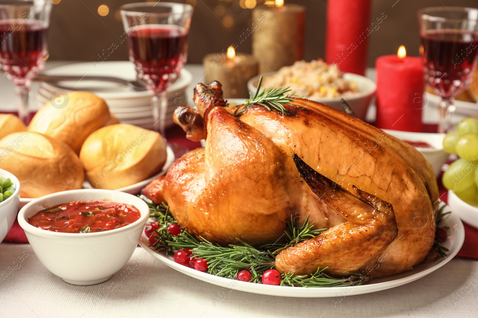 Photo of Traditional festive dinner with delicious roasted turkey served on table