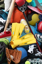 Photo of Many different sports equipment as background, top view