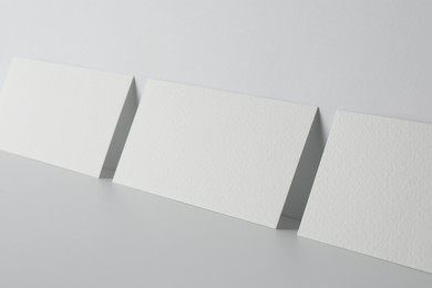 Photo of Blank business cards on white background. Mockup for design