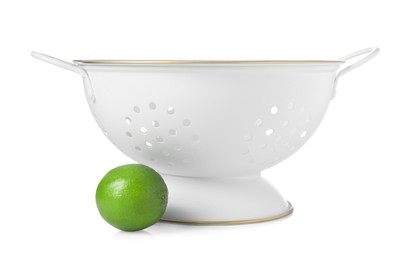 Photo of Colander with fresh lime isolated on white