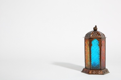 Photo of Muslim lamp on white background with space for text. Fanous as Ramadan symbol