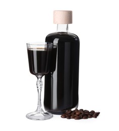 Glassware with coffee liqueur and beans isolated on white