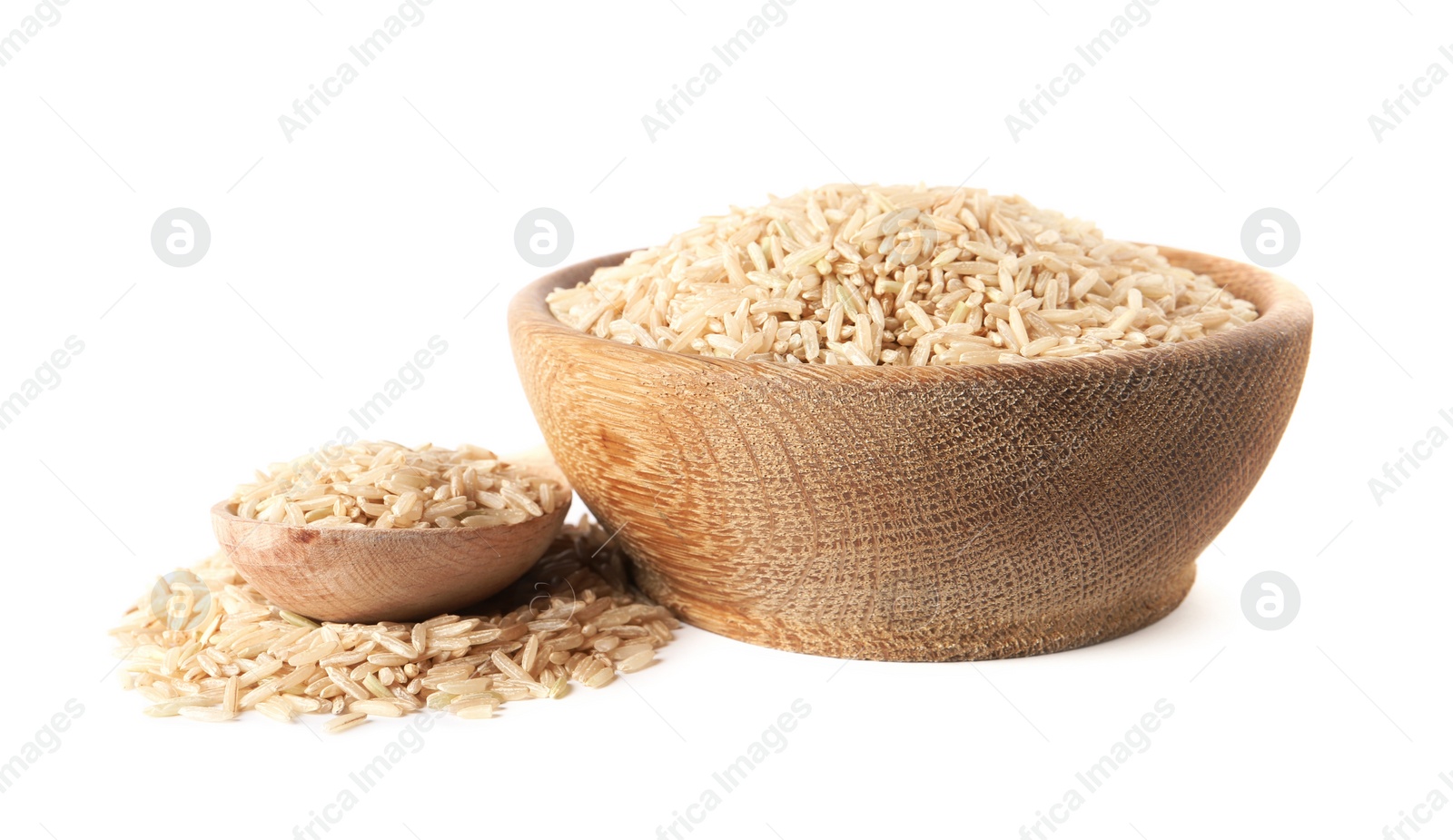 Photo of Bowl and spoon with uncooked brown rice on white background