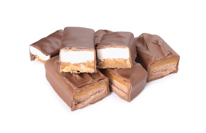 Photo of Pieces of tasty chocolate bars with nougat and nuts on white background