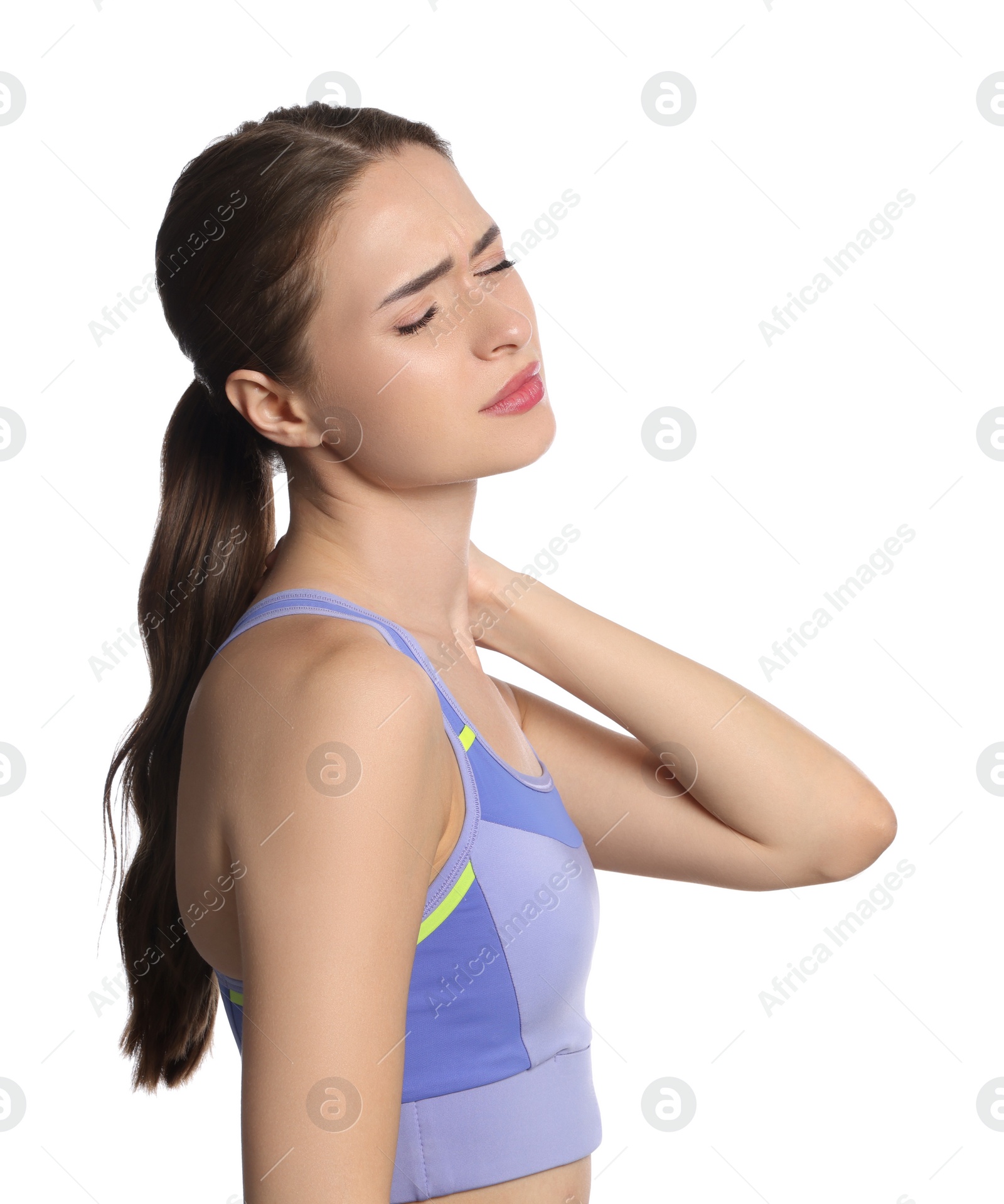 Photo of Young woman suffering from neck pain on white background