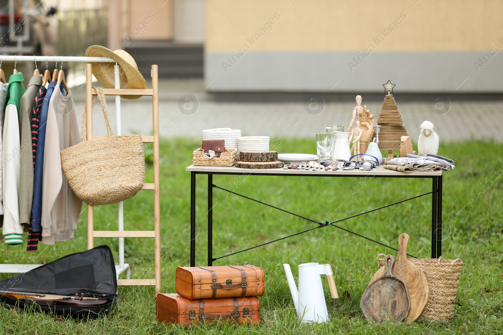 Photo of Many different items selling in yard. Garage sale