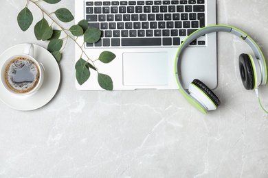 Photo of Flat lay composition with headphones, laptop and space for text on grey background