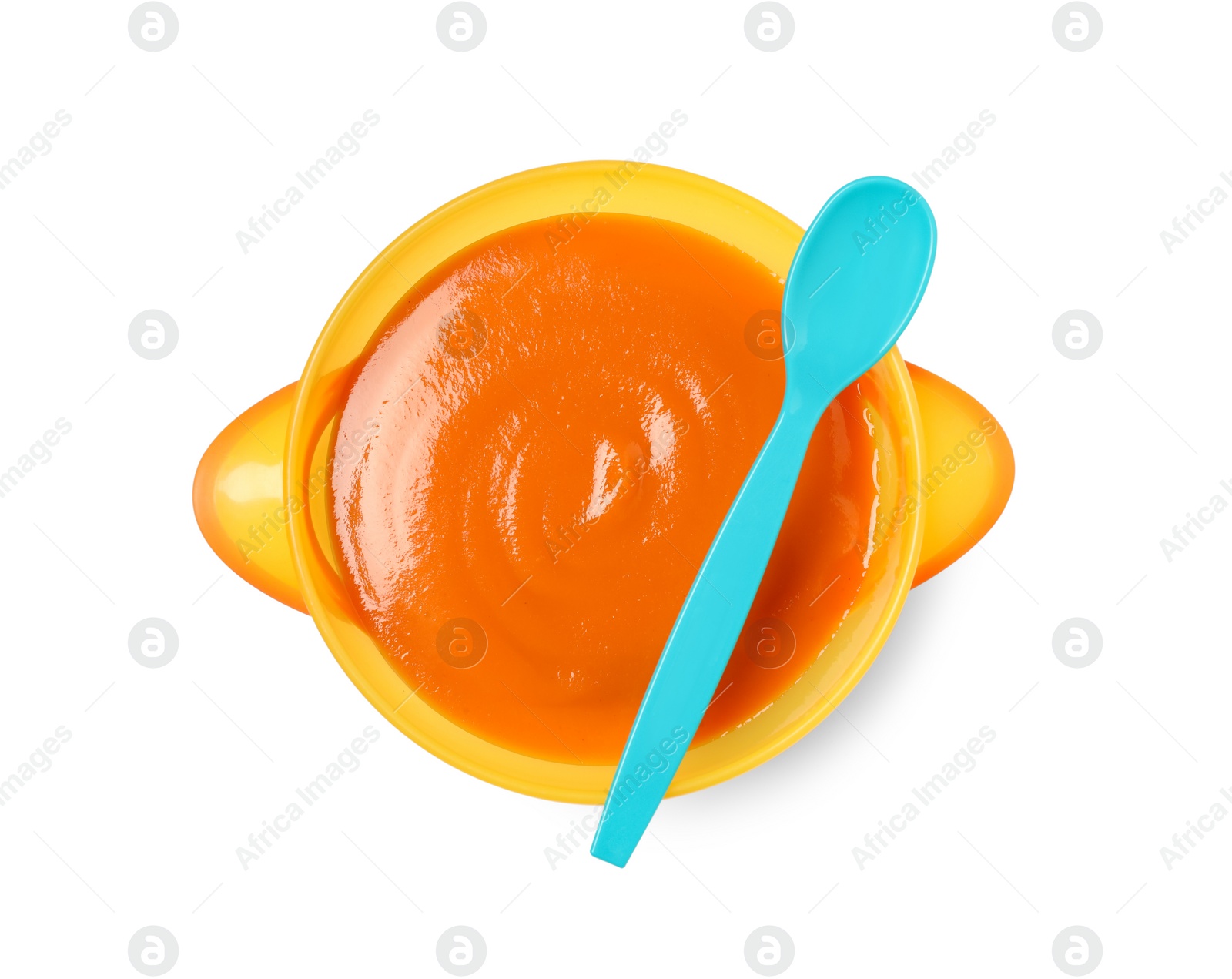 Photo of Delicious baby food in bowl and spoon isolated on white, top view