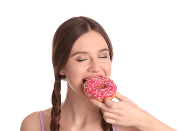 Photo of Beautiful young woman eating donut on white background