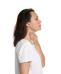 Photo of Mature woman doing thyroid self examination on white background